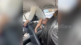 Kid gets into awkward position in car with parents