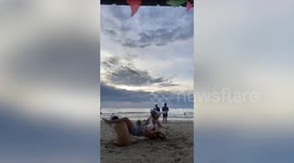 Woman's cartwheel fails when she lands on her friend