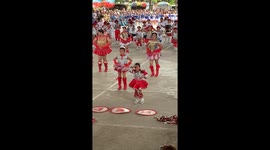Energetic schoolgirl stands out in class parade with her dance moves