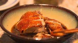 Close up of Nanjing Roast Duck Clamping with Chopsticks at Nanjing Restaurant in Nanjing, Jiangsu Province