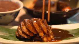 Close up of Nanjing Food stall in Nanjing, Jiangsu Province, with chopsticks and glutinous rice lotus root