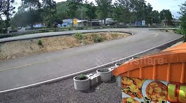 Motorcycle riders fall into pit separating two lanes at highway in Thailand