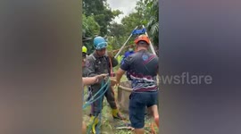 Firemen rescue father who fell into 25ft-deep well