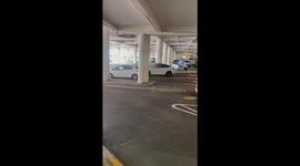 Tesla Driver Runs Over Charging Station and Drags It Away