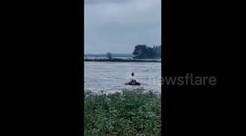 Brave man risks life to save neighbour swept away by rapid floodwater in China