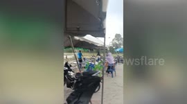 Tent blown over by storm during school sports event in Thailand
