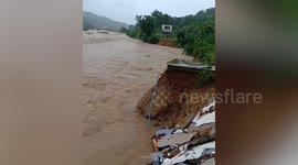 Overflowing river destroys home in Laos