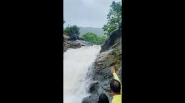 Adventurous ride: man takes on the playful waters of Mulshi Waterfall, Maharashtra