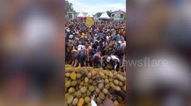 Frenzied locals scramble to grab free durian fruit at Durian Festival in Indonesia