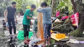 Visitors enjoy swimming and exploring natural spring in the Philippines