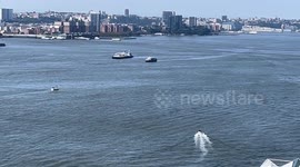 Concorde floating down Hudson River on a barge enroute to Brooklyn shipyard
