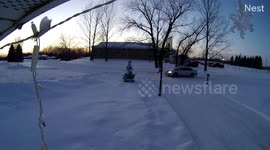 Snowmobile Crashes Into Garage Moments After Owners Leave (ID: 314544532)