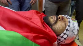 Relatives and friends of Palestinian Ameer Khalifa, mourn over his body at the morgue in the West Bank city of Nablus.