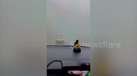 Driver pulls over as thick fog shrouds road in Thailand