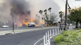 Fire burns in a commercial district in Lahaina, Hawaii