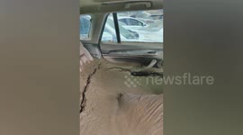 Driver's brand new BMW covered in mud after storm in China