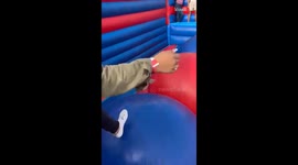 ENTIRE family gets their balance deflated while hopping around on an inflatable castle