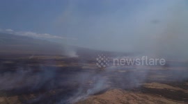 Hawaii Army National Guard helicopters join fight to extinguish wildfires that have claimed more than 50 lives