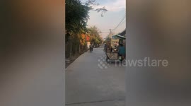 Youngsters try to show off with wheelie on scooter... only to crash into fence