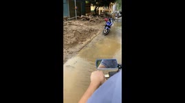 Vietnamese village swamped by mud and rocks following devastating flash floods