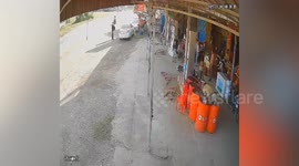 Ghost motorcycle without rider rolls into shop in Cambodia