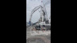 Giant excavator demolishing Atalanta FC stadium