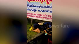 Dog stuck in canal rescued by passersby using sticks and blanket