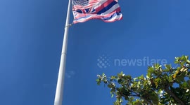 US and Hawaiian Flag over Lahaina | Wildfire destroyed tourist hotspot town Lahaina on Maui in Hawaii | video filmed shortly before the fire devastated Lahaina