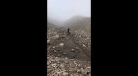 Mountain Biker Falls Down Rocky Slope