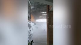 Storm batters school gym as heavy rain lashes Thailand