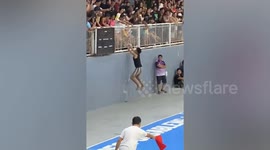 Basketball game fans have funny dance showdown on either side of court