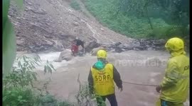 Rescue officials come to the aid of man trapped in river in northern India
