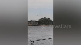 Waterspout tornado damages homes before capsizing BOAT leaving two passengers missing and six injured