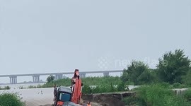 Man saves fellow villager from rushing water in NE China