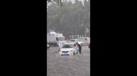 Heroic driver saves struggling woman from China flood
