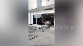 Car crashes through shop front in shopping mall in Thailand