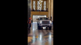 Squeezing a Big Christmas Tree Through a Small Doorway (ID: 371365529)