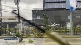 Parking lot roofs ripped out of place by strong winds as Typhoon Lan hits Japan