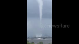 Tornado cloud formation appears as Typhoon Lan makes landfall in Japan