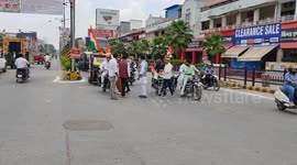 Motorists celebrate India Independence Day by parading flags through streets