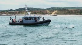 Amazing moment bottlenose dolphins follow conservation boat off Norfolk coast in rare sighting