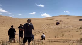 Gravity-defying stunts: pickup soars and lands with elegance over Xuzhou sand dunes