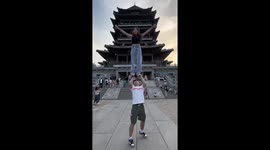 Athletic duo pulls off jaw-dropping acrobat stunt near Chinese ancient landmark
