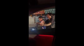 Young Boy's Rhythmic Dance to Car Music Captures Hearts in Fujian, China