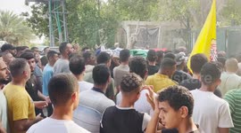 Mourners carry the bodies of Two Palestinians who were killed in an Israeli raid, during their funeral in the West Bank city of Jericho.