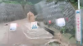 Japan: Rivers Swell As Typhoon Lan Brings Torrential Rain 7