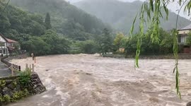 Raging torrents: Yoshii River swells amidst heavy rain