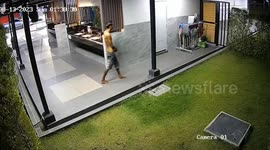 Shirtless man sets mops on fire at fuel station in Thailand