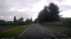Driving through a flooded road after a period of heavy rain