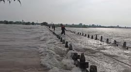 Heavy rain submerges bridge under water in northern India